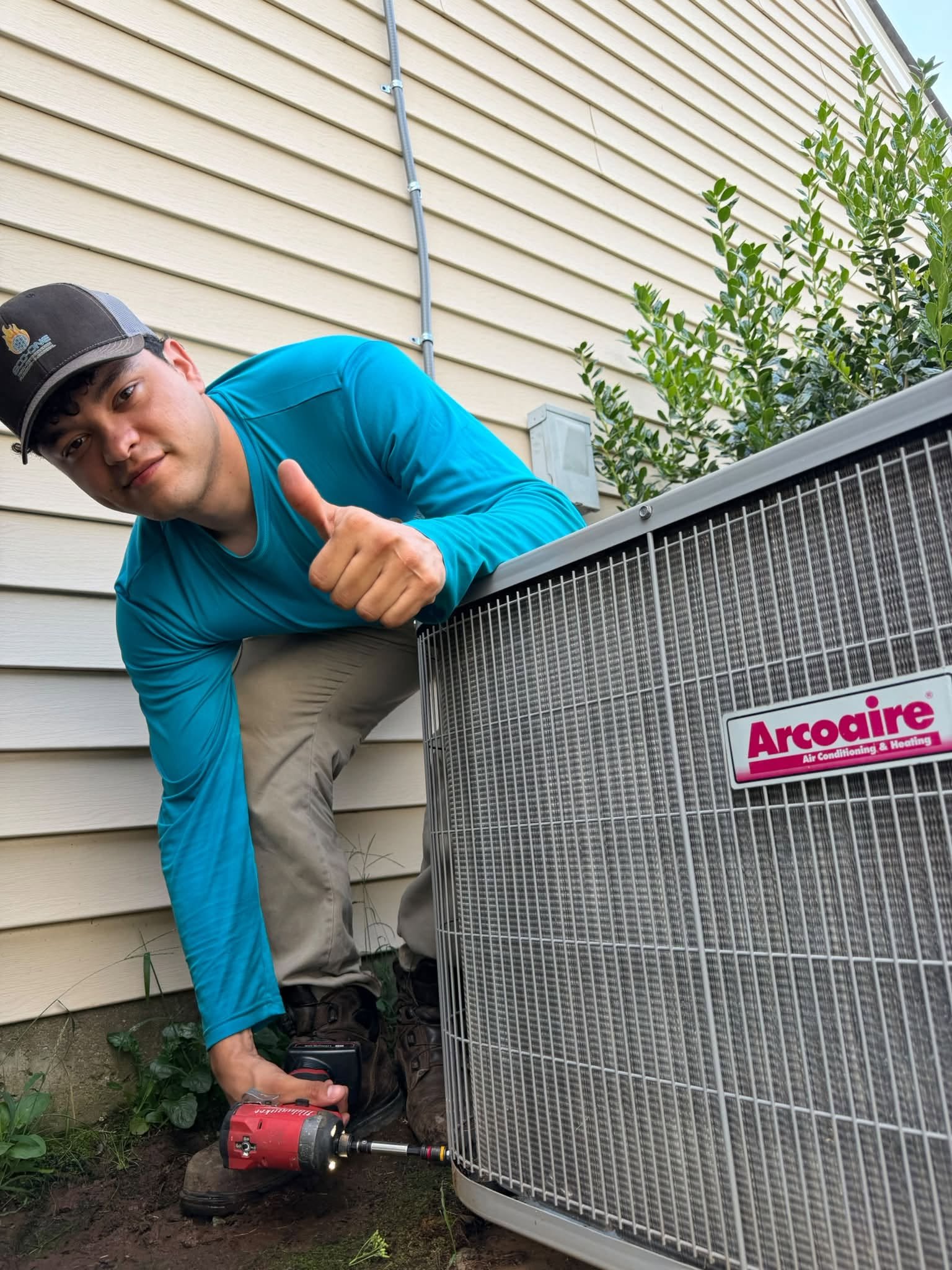 Eco-One technician servicing an outdoor air conditioning system